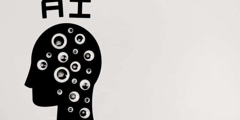 Ilustração de uma cabeça humana em silhueta preenchida por olhos, representando inteligência artificial, observação e privacidade de dados.